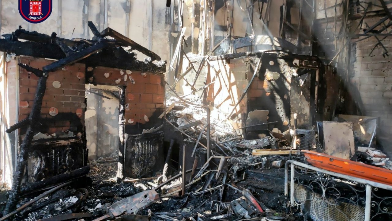 This handout photo made available by Bomberos de Murcia on October 1, 2023, shows the burned interior of a nightclub where a fire at least killed thirteen people in Murcia, on October 1, 2023. At least 13 people were killed in a fire in a Spanish nightclub on October 1, 2023 morning, officials said, with fears the toll could still rise as rescue workers sift through the debris. The fire appears to have broken out in a building housing the "Teatre" and "Fonda Milagros" clubs in the city of Murcia in southeastern Spain. (Photo by Handout / Bomberos de Murcia / AFP) / RESTRICTED TO EDITORIAL USE - MANDATORY CREDIT "AFP PHOTO / BOMBEROS DE MURCIA " - NO MARKETING NO ADVERTISING CAMPAIGNS - DISTRIBUTED AS A SERVICE TO CLIENTS
