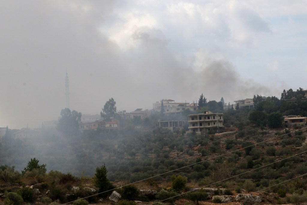 A general view shows smoke rising on a hill shelled by Israeli forces on the outskirts of the southern Lebanese border village of Dhaira on October 11, 2023. Lebanon's Iran-backed Hezbollah and Israel exchanged fire on October 11, in missile strikes the group said were retaliation for the killing of three members, on the fourth day of cross-border tensions. (Photo by Mahmoud ZAYYAT / AFP)