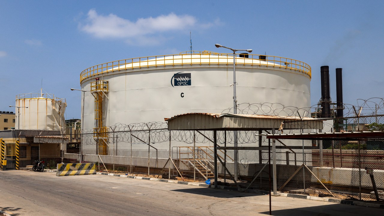 (FILES) This picture taken on August 6, 2022 shows a view of a fuel silo at the Nuseirat natural gas power station, the sole plant operating in the Palestinian Gaza Strip. The only power plant in the Gaza Strip, which is under Israeli bombardment and siege, shut down on October 11 after it ran out of fuel, said the Palestinian enclave's electricity authority, as clashes betweeen Israel and Hamas continue. (Photo by MOHAMMED ABED / AFP)