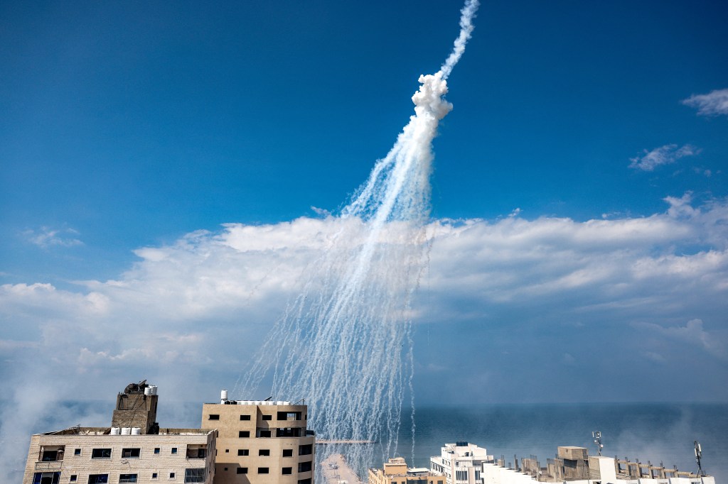Smoke from Israeli bombardment is pictured over the Gaza City seaport on October 11, 2023. Israel declared war on Hamas on October 8 following a shock land, air and sea assault by the Gaza-based Islamists. The death toll from the shock cross-border assault by Hamas militants rose to 1,200, making it the deadliest attack in the country's 75-year history, while Gaza officials reported more than 900 people killed as Israel pounded the territory with air strikes. (Photo by MOHAMMED ABED / AFP)