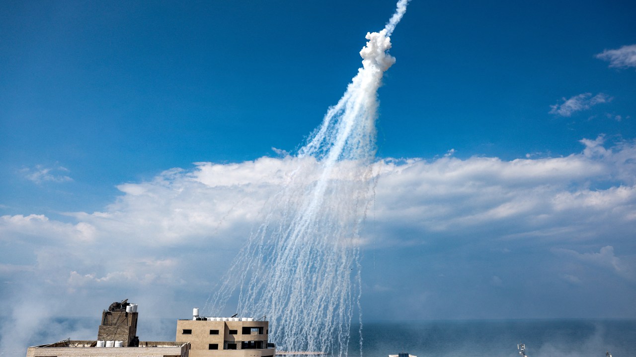 Smoke from Israeli bombardment is pictured over the Gaza City seaport on October 11, 2023. Israel declared war on Hamas on October 8 following a shock land, air and sea assault by the Gaza-based Islamists. The death toll from the shock cross-border assault by Hamas militants rose to 1,200, making it the deadliest attack in the country's 75-year history, while Gaza officials reported more than 900 people killed as Israel pounded the territory with air strikes. (Photo by MOHAMMED ABED / AFP)