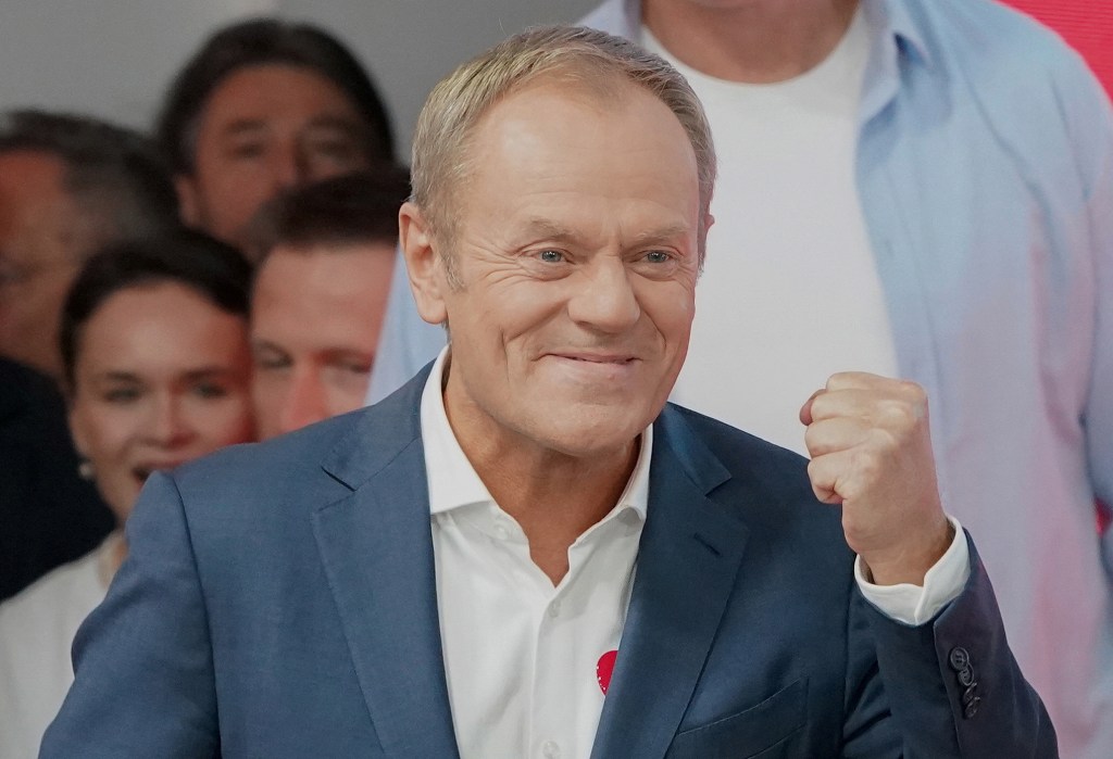 Poland's main opposition leader, former premier and head of the centrist Civic Coalition bloc, Donald Tusk addresses supporters at the party's headquarters in Warsaw, Poland on October 15, 2023, after the presentation of the first exit poll results of the country's parliamentary elections. Poland's liberal Civic Coalition led by former EU chief Donald Tusk and two smaller opposition parties have a majority over the ruling populists and the far-right, an exit poll from Sunday's election showed. (Photo by JANEK SKARZYNSKI / AFP) / ALTERNATE CROP