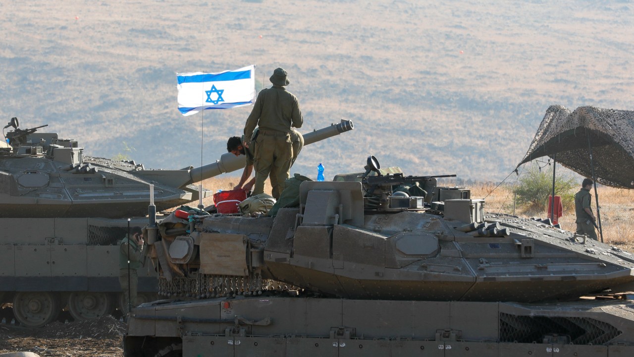 Israeli Merkava tanks are positioned in the north of Israel near the border with Lebanon on October 15, 2023. (Photo by Jalaa MAREY / AFP)