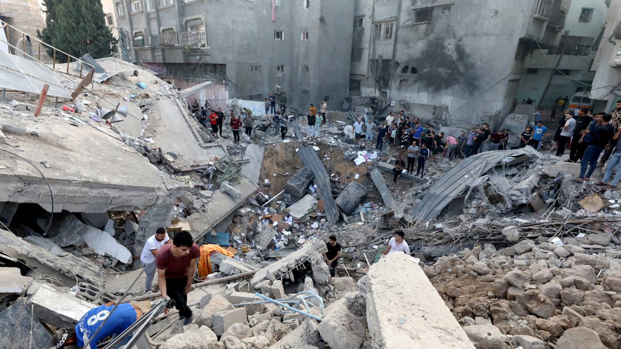 Palestinians search the destroyed annex of the Greek Orthodox Saint Porphyrius Church, the oldest church still in use in Gaza, damaged in a strike on Gaza City on October 20, 2023, amid the ongoing battles between Israel and the Palestinian group Hamas. Thousands of people, both Israeli and Palestinians have died since October 7, 2023, after Palestinian Hamas militants based in the Gaza Strip, entered southern Israel in a surprise attack leading Israel to declare war on Hamas in Gaza on October 8. (Photo by Dawood NEMER / AFP)