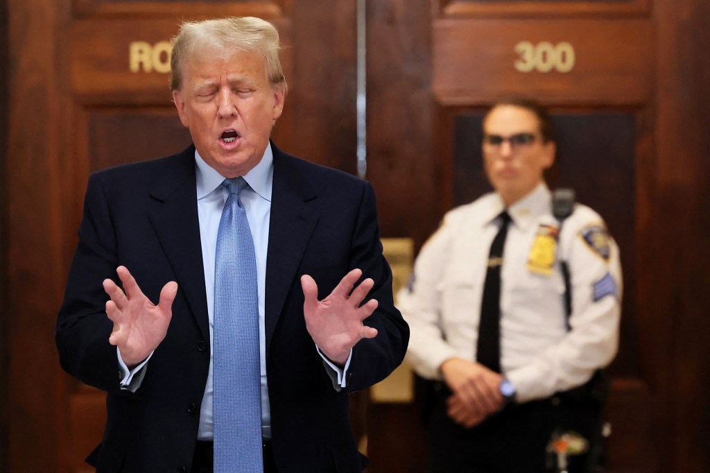 NEW YORK, NEW YORK - OCTOBER 18: Former President Donald Trump speaks after returning from a break during his civil fraud trial at New York State Supreme Court on October 18, 2023 in New York City. Trump may be forced to sell off his properties after Justice Arthur Engoron canceled his business certificates after ruling that he committed fraud for years while building his real estate empire after being sued by Attorney General Letitia James, who is seeking $250 million in damages. The trial will determine how much he and his companies will be penalized for the fraud. Michael M. Santiago/Getty Images/AFP (Photo by Michael M. Santiago / GETTY IMAGES NORTH AMERICA / Getty Images via AFP)