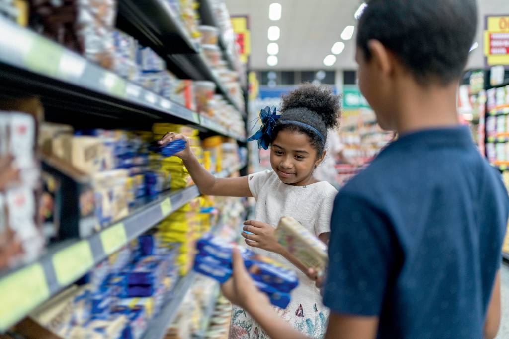 Kids choosing products at grocery store Kids choosing products at grocery store