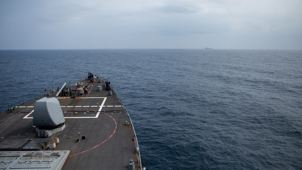 In this image obtained fro the US Department of Defense, the Arleigh Burke-class guided-missile destroyer USS Laboon approaches the oiler USNS Kanawha (background) for replenishment-at-sea operation in the Red Sea on December 25, 2023. The US Central Command said in a social media post on January 6, 2024, that "an unmanned aerial vehicle launched from Iranian-backed Huthi-controlled areas of Yemen was shot down in self-defense" by the USS Laboon in the Red Sea. The incident came just days after a 12-nation group led by the US warned Huthi rebels in Yemen against continuing their attacks on Red Sea shipping. (Photo by Elexia Morelos / US Department of Defense / AFP) / RESTRICTED TO EDITORIAL USE - MANDATORY CREDIT "AFP PHOTO / US Department of Defense/US Navy/Mass Communication Specialist 2nd Class Elexia Morelos" - NO MARKETING NO ADVERTISING CAMPAIGNS - DISTRIBUTED AS A SERVICE TO CLIENTS