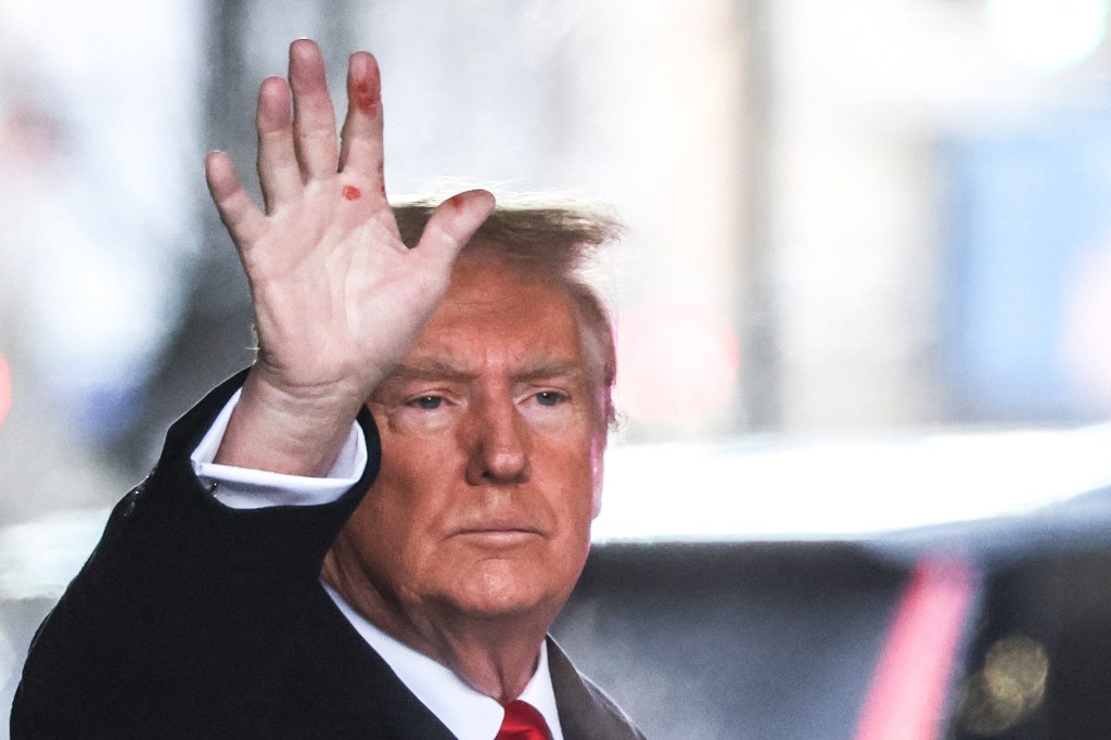 Former US President Donald Trump leaves Trump Tower for Manhattan federal court for the second defamation trial against him, in New York City on January 17, 2024. Writer E. Jean Carroll is seeking more than $10 million in damages in the civil trial, alleging that Trump defamed her in 2019 when he was president and she had just come out with her allegation, saying she "is not my type." This is separate to a civil case last year where another New York jury found Trump liable for sexually assaulting Carroll in a department store dressing room in 1996 and subsequently defaming her in 2022, when he called her a "complete con job." (Photo by Charly TRIBALLEAU / AFP)