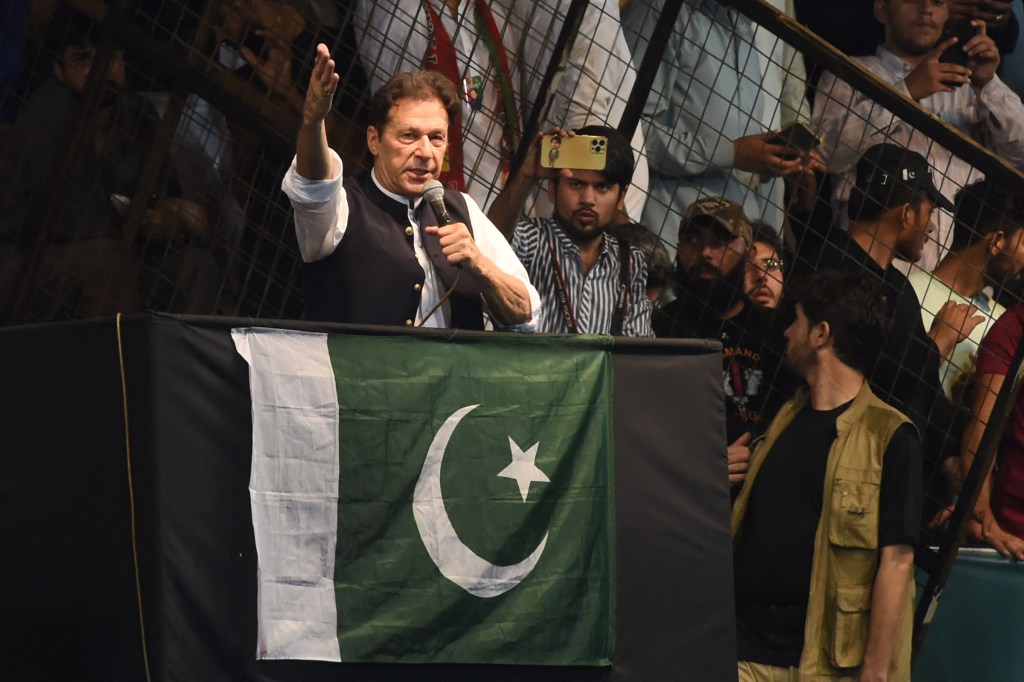 (FILES) Pakistan's former Prime Minister and Pakistan Tehreek-e-Insaf party (PTI) chief Imran Khan, delivers a speech to his supporters during a rally celebrate the 75th anniversary of Pakistan's independence day in Lahore on August 13, 2022. Former Pakistan prime minister Imran Khan was sentenced to 10 years in prison on January 30, 2024, less than two weeks before the country votes in an election his party has been hamstrung from contesting. The same sentence was given to Shah Mehmood Qureshi, who served as foreign minister under Khan whose four-year premiership ended in 2022. (Photo by Arif ALI / AFP)