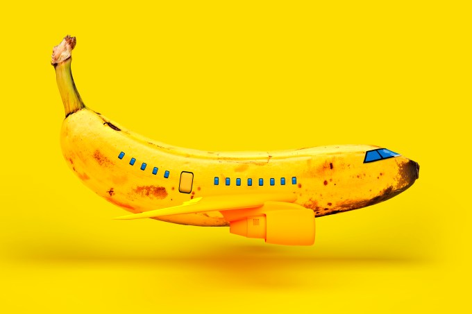 Banana representing airplane against yellow background