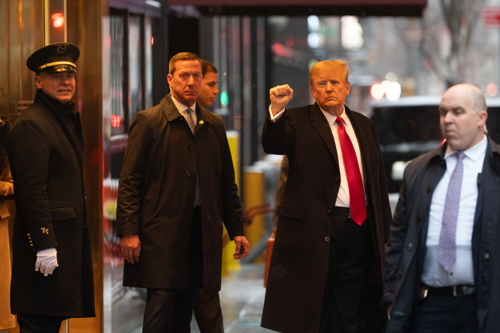 Former President Donald Trump, second right, departs Trump Tower in New York, US, on Tuesday, Jan. 16, 2024. Fresh off his victory in the Iowa Republican caucuses, Donald Trump is set to face a New York jury this week in the next high-stakes trial of his crowded legal calendar, a defamation lawsuit by writer E. Jean Carroll, who claims he raped her in the 1990s. Photographer: David Dee Delgado/Bloomberg via Getty Images