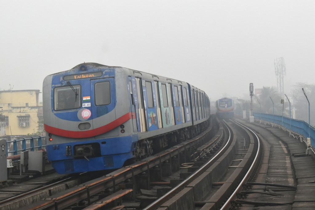 Metro trains are moving through the fog on a winter morning in Kolkata, India, on December 24, 2023. (Photo by Sudipta Das/NurPhoto via Getty Images)