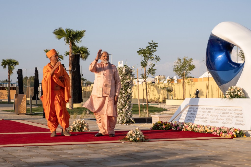 Narendra Modi, India's prime minister, right, during the inauguration of the newly-constructed BAPS Hindu Mandir temple in Abu Dhabi, United Arab Emirates, on Wednesday, Feb. 14, 2024. Modi's visit to the UAE is the latest sign of warmer ties between the two countries, with both nations looking to deepen commercial, strategic and cultural relations. Photographer: Natalie Naccache/Bloomberg via Getty Images