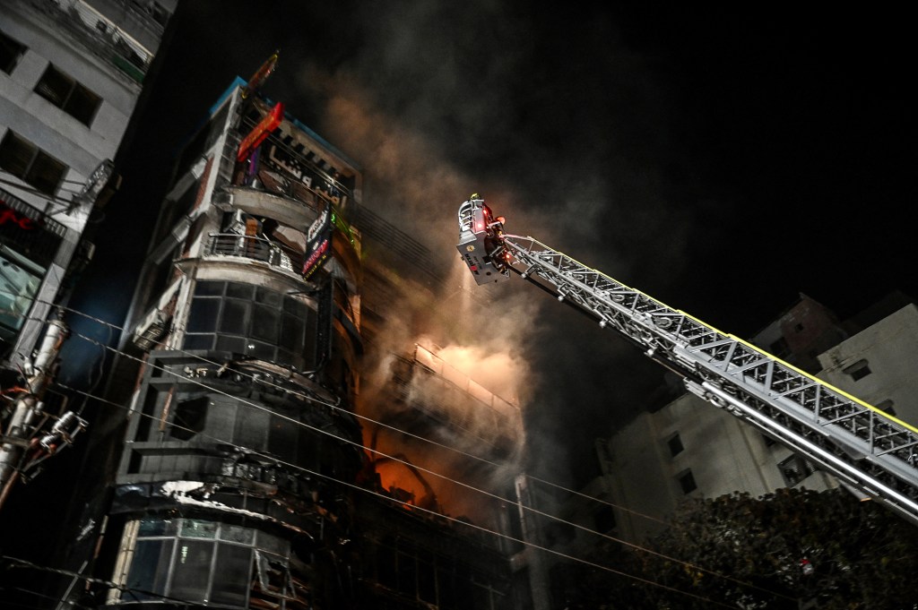 Firefighters work to extinguish a fire in a commercial building that killed at least 43 people, in Dhaka, on February 29, 2024. At least 43 people were killed and dozens injured after a fire blazed through a seven-storey building in an upscale neighbourhood in the Bangladeshi capital of Dhaka late on February 29, health authorities said. (Photo by Munir Uz Zaman / AFP)