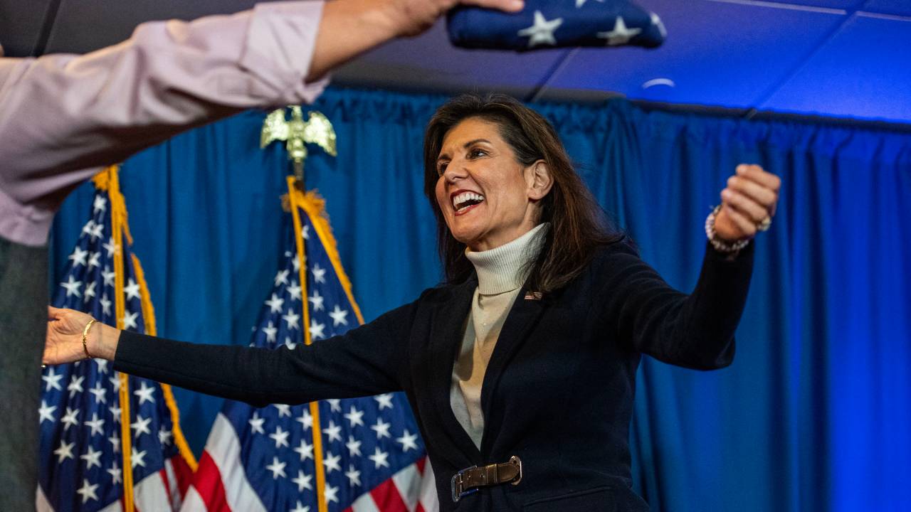 US Republican presidential hopeful and former UN Ambassador Nikki Haley reaches out to embraces Retired Brig. Gen. Donald Bolduc before speaking during a campaign rally in Portland, Maine, on March 3, 2024. (Photo by Joseph Prezioso / AFP)