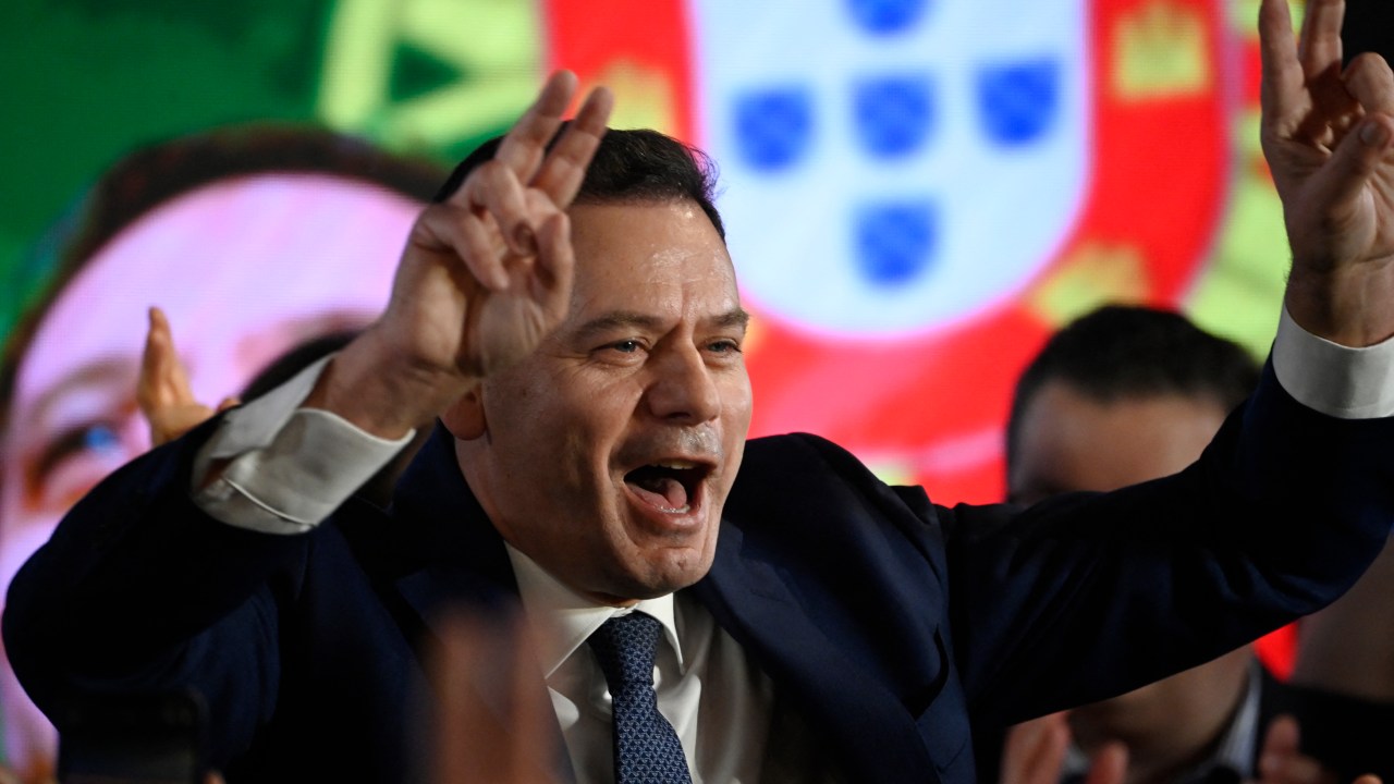 Democratic Alliance (AD) leader Luis Montenegro celebrates his victory as he addresses supporters at the party's election night headquarters, in Lisbon on March 10, 2024. Portugal's main centre-right party narrowly defeated the incumbent Socialists but fell well short of a majority in a general election today in which far-right Chega surged to become a potential kingmaker. (Photo by MIGUEL RIOPA / AFP)