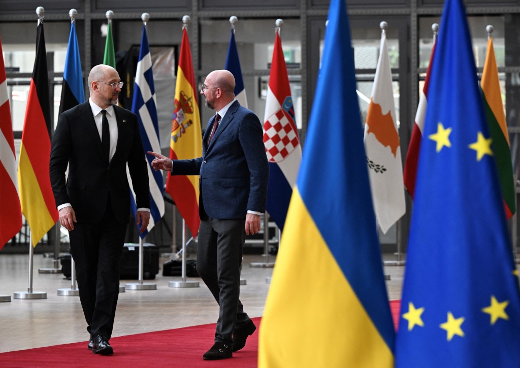 European Council President Charles Michel (R) welcomes Ukraine's Prime Minister Denys Shmyhal (L) before their bilateral meeting at the EU headquarters in Brussels, on March 20, 2024. (Photo by JOHN THYS / AFP)