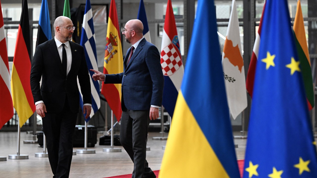 European Council President Charles Michel (R) welcomes Ukraine's Prime Minister Denys Shmyhal (L) before their bilateral meeting at the EU headquarters in Brussels, on March 20, 2024. (Photo by JOHN THYS / AFP)