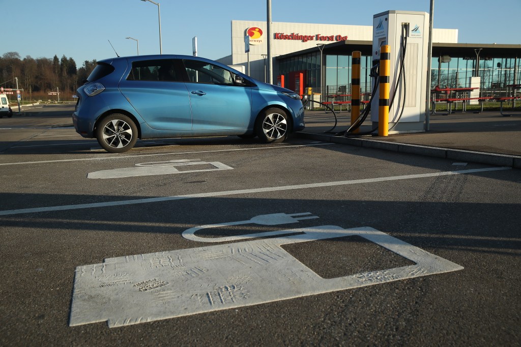 INGOLSTADT, GERMANY - DECEMBER 07: An electric car charges at a charging station at a rest area along the A9 highway on December 7, 2017 near Ingolstadt, Germany. Germany is expanding its network of electric car charging stations in an effort to promote the growth of electric car usage. (Photo by Sean Gallup/Getty Images)