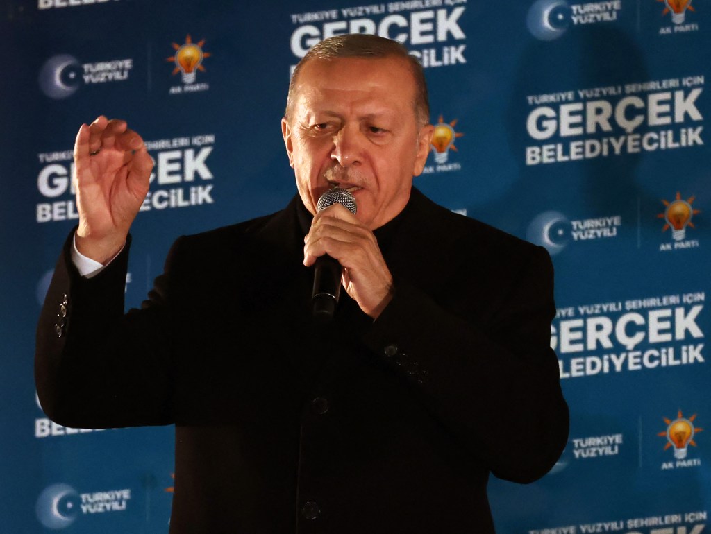 Turkish President and leader of Justice and Development (AK) Party Recep Tayyip Erdogan delivers a speech after the Turkish local Municipal elections, at AK Party Headquarters in Ankara on April 1, 2024. Turkey's main opposition party on March 31 claimed victory in Istanbul and Ankara, with its rising political star emerging from local elections as a serious challenger to veteran President Recep Tayyip Erdogan. Erdogan, addressing supporters at his party's headquarters in Ankara, acknowledged a "turning point" for his party and promised to respect the results. Partial results from across the nation of 85 million people showed major advances for the Republican People's Party (CHP) at the expense of Erdogan's Justice and Development Party (AKP) that has dominated politics for more than two decades. (Photo by Adem ALTAN / AFP)