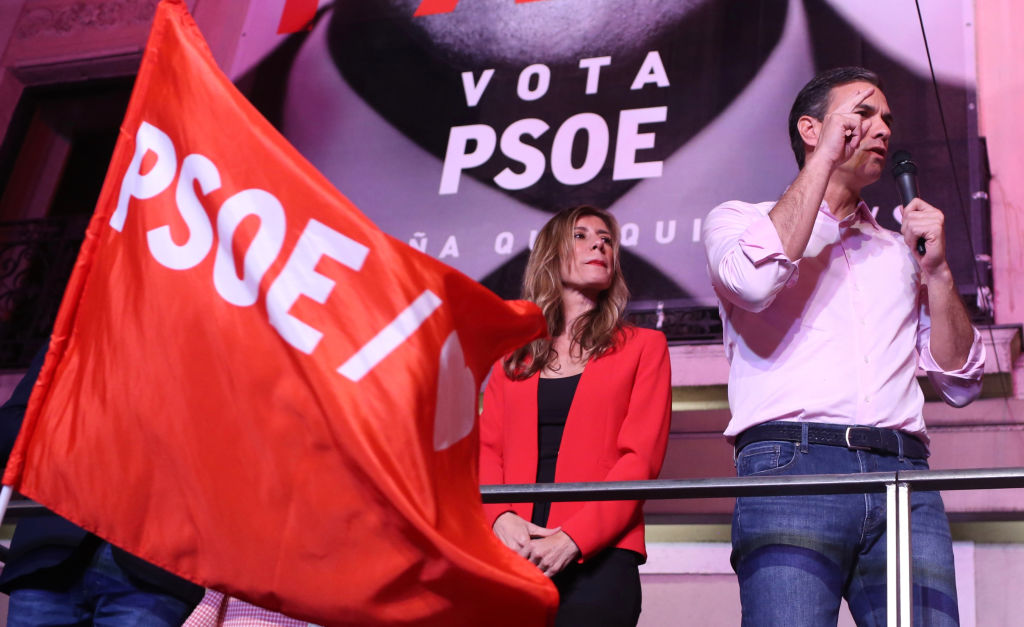 28 April 2019, Spain, Madrid: Pedro Sanchez, Prime Minister of Spain and candidate of the Socialist Party (PSOE), cheers with his supporters in the presence of his wife Begonia Gomez in front of the party headquarters on election night. In front of hundreds of supporters, Sanchez celebrated the victory of his party in the new parliamentary elections. Photo: Cèzaro De Luca/dpa (Photo by Cèzaro De Luca/picture alliance via Getty Images)