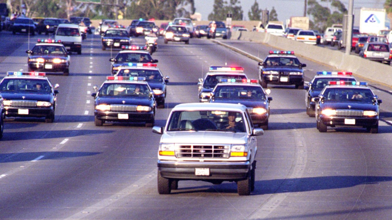 California Highway Patrol chase Al Cowlings, driving, and O.J. Simpson, hiding in rear of white Bronco on the 91 Freeway, just West of the I5 freeway. The chase ended in Simpson's arrest at his Brentwood home. (Photo by Allen J. Schaben/Los Angeles Times via Getty Images)