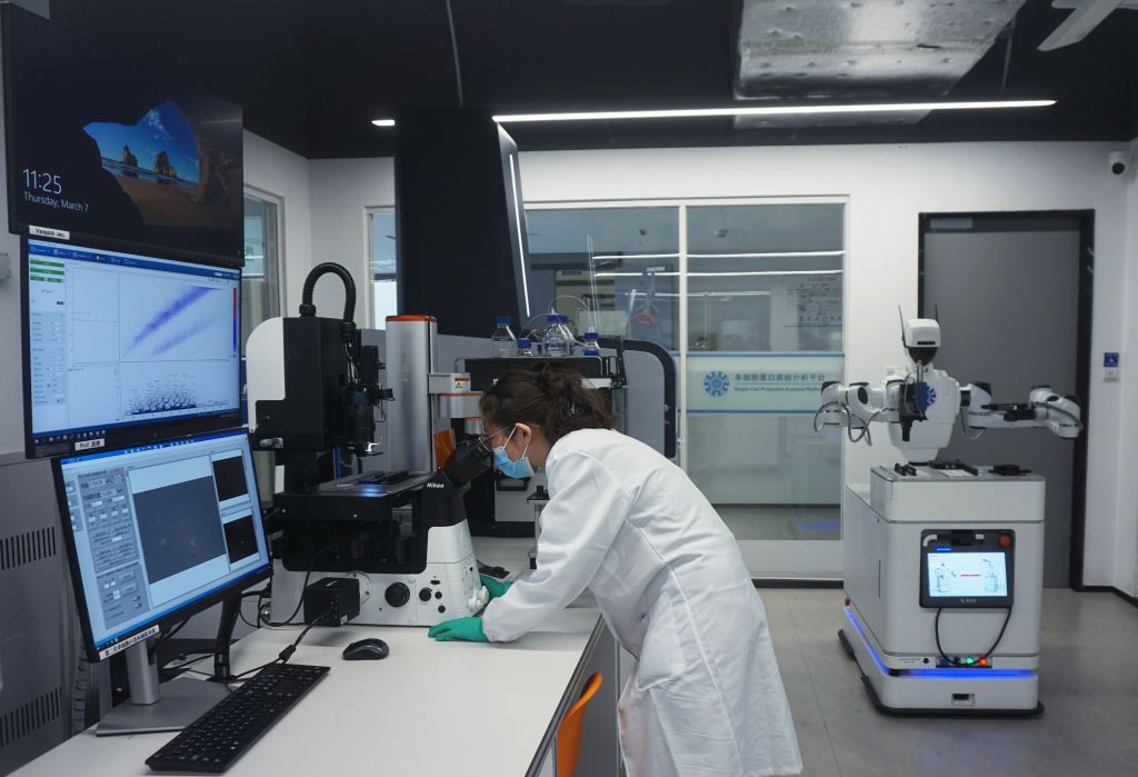 A researcher is watching the results of protein analysis on a fully automated single-cell proteome analysis platform at the Hangzhou International Science and Innovation Center Laboratory of Zhejiang University in Hangzhou, Zhejiang Province, China, on March 7, 2024. (Photo by Costfoto/NurPhoto via Getty Images)