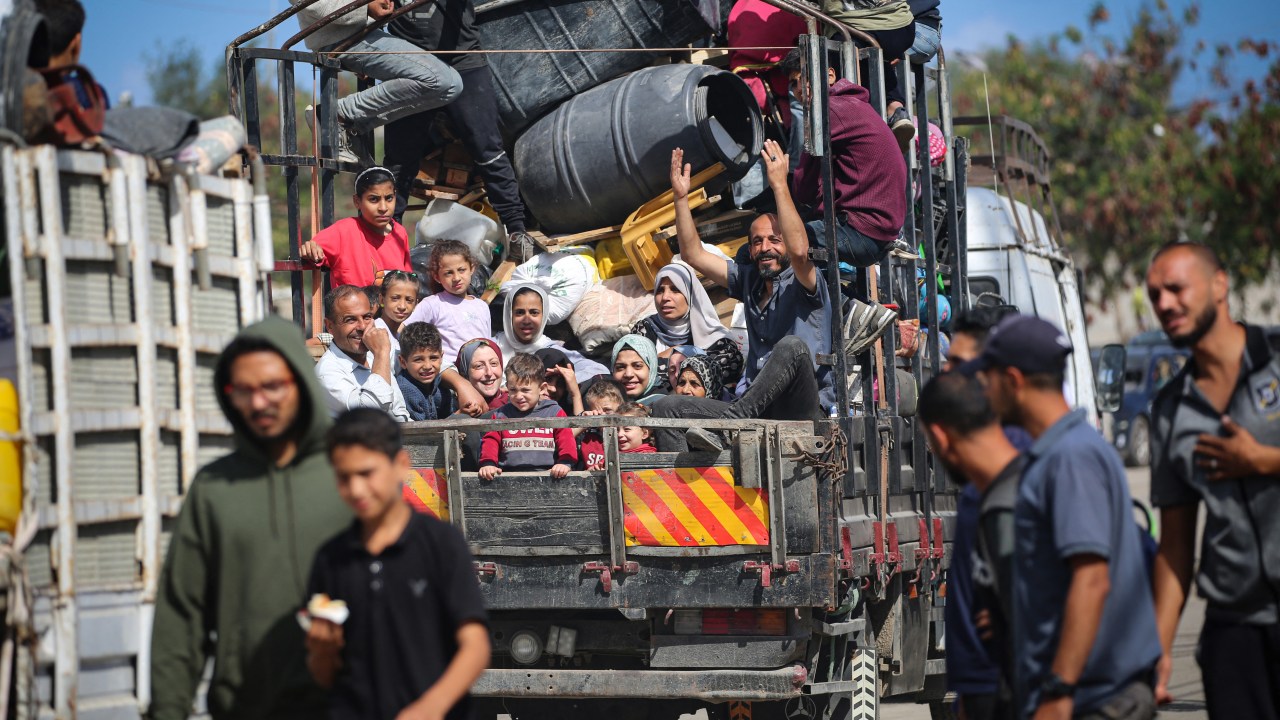 Displaced Palestinians flee Rafah with their belongings to safer areas in the southern Gaza Strip on May 7, 2024 following an evacuation order by the Israeli army the previous day, amid the ongoing conflict between Israel and the Palestinian Hamas movement. (Photo by AFP)