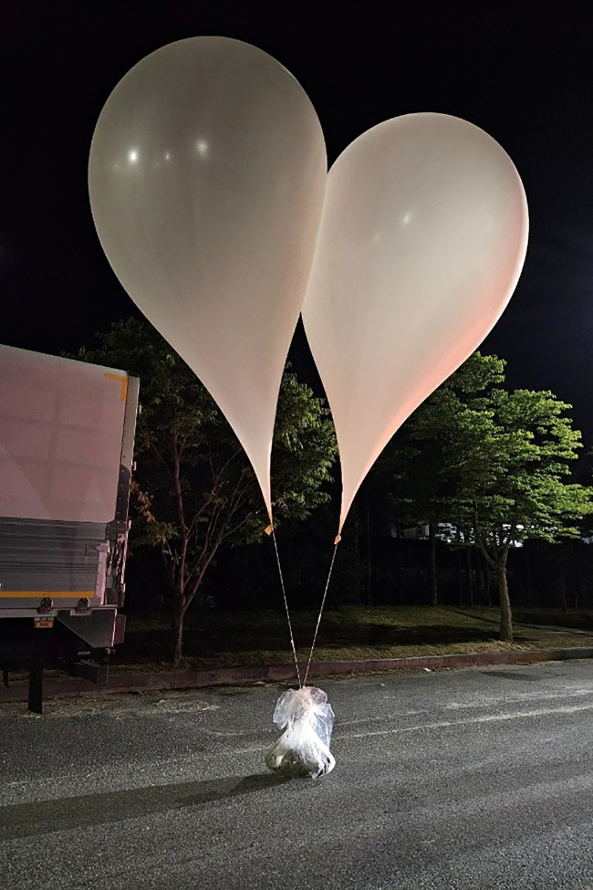 This handout photo taken by the South Korean Defence Ministry between the night of May 28 and 29, 2024 and released on May 29 shows unidentified objects believed to be North Korean propaganda material attached to balloons on a street in Chungnam Province. North Korea dropped suspected anti-South Korean 