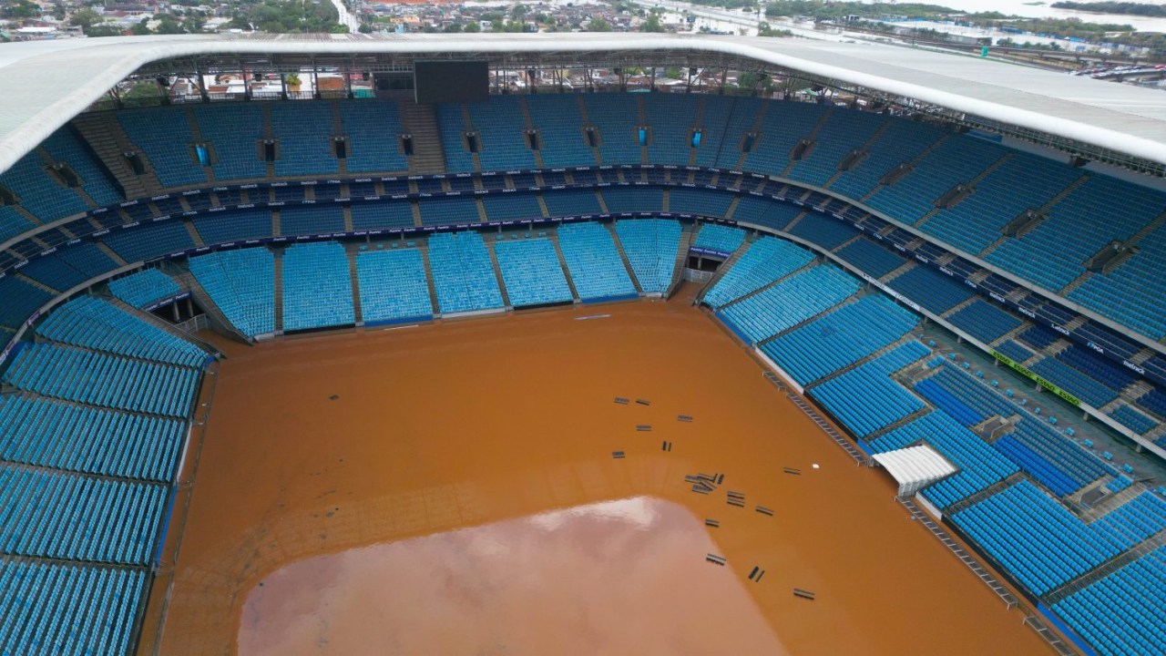 PORTO ALEGRE, BRAZIL - MAY 5: In this aerial view, flood waters surround the Gremio Arena after heavy rain on May 5, 2024 in Porto Alegre, Brazil. Rains have struck heavily the Brazilian state of Rio Grande do Sul causing damage to the infrastructure and displacing more than 20,000 people. Authorities report over 30 fatalities and expect the death toll to increase while dozens of people are still missing. (Photo by Ramiro Sanchez/Getty Images)
