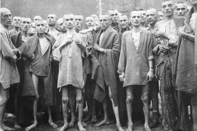 Starved prisoners, nearly dead from hunger, pose in concentration camp May 7, 1945 in Ebensee, Austria. The camp was reputedly used for “scientific” experiments.