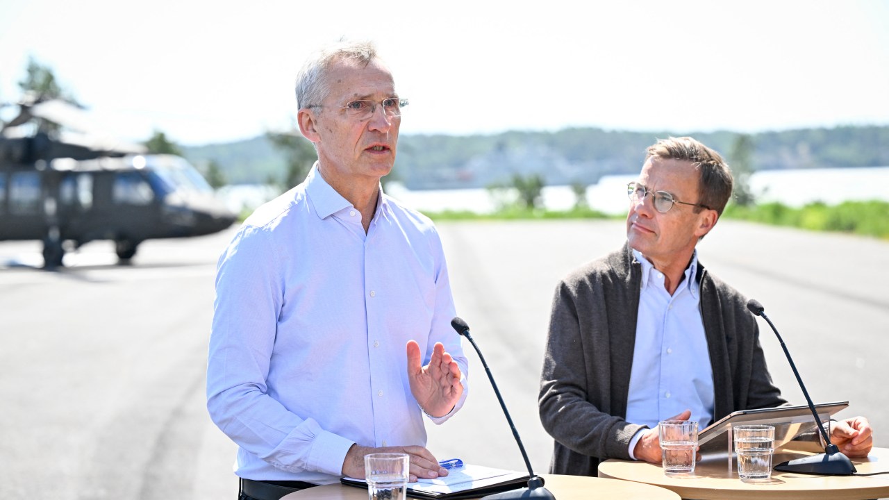 NATO Secretary General Jens Stoltenberg (L) and Sweden's Prime Minister Ulf Kristersson hold a news conference in connection with bilateral talks and a demonstration of the Swedish Armed Forces' activities at the Stockholm Amphibian Regiment, Berga, Haninge, outside Stockholm, Sweden, on June 7, 2024. (Photo by Henrik MONTGOMERY / TT NEWS AGENCY / AFP) / Sweden OUT