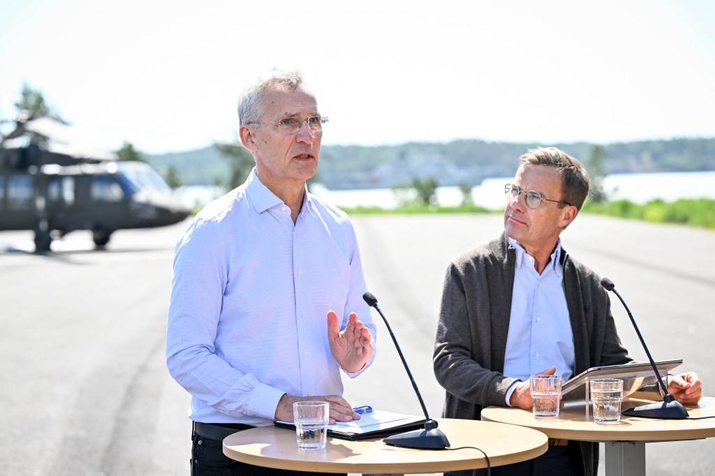 NATO Secretary General Jens Stoltenberg (L) and Sweden's Prime Minister Ulf Kristersson hold a news conference in connection with bilateral talks and a demonstration of the Swedish Armed Forces' activities at the Stockholm Amphibian Regiment, Berga, Haninge, outside Stockholm, Sweden, on June 7, 2024. (Photo by Henrik MONTGOMERY / TT NEWS AGENCY / AFP) / Sweden OUT