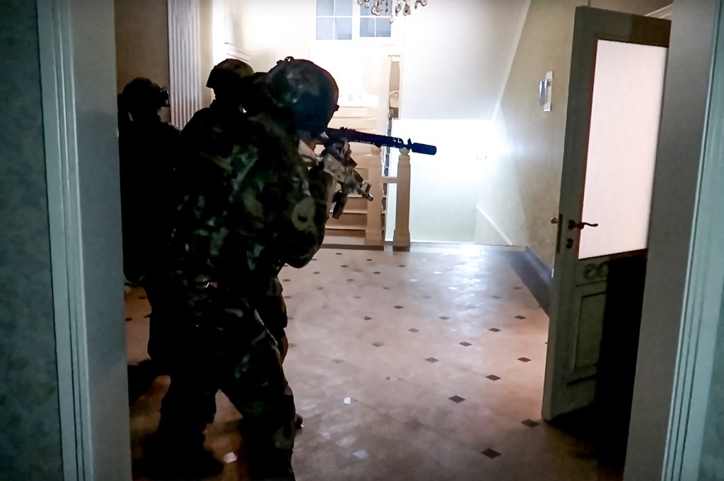 In this grab taken from a handout footage released by the National Antiterrorism Committee on June 24, 2024, Russia's FSB security service officers conduct an anti-terrorist operation in Dagestan. An operation against gunmen who attacked churches and a synagogue in Russia's Muslim-dominated Dagestan region and killed at least 16 people is over, the national anti-terrorism agency said on June 24, 2024. (Photo by Handout / Russia's National Antiterrorism Committee / AFP) / RESTRICTED TO EDITORIAL USE - MANDATORY CREDIT "AFP PHOTO / Russia's National Antiterrorism Committee" - NO MARKETING NO ADVERTISING CAMPAIGNS - DISTRIBUTED AS A SERVICE TO CLIENTS