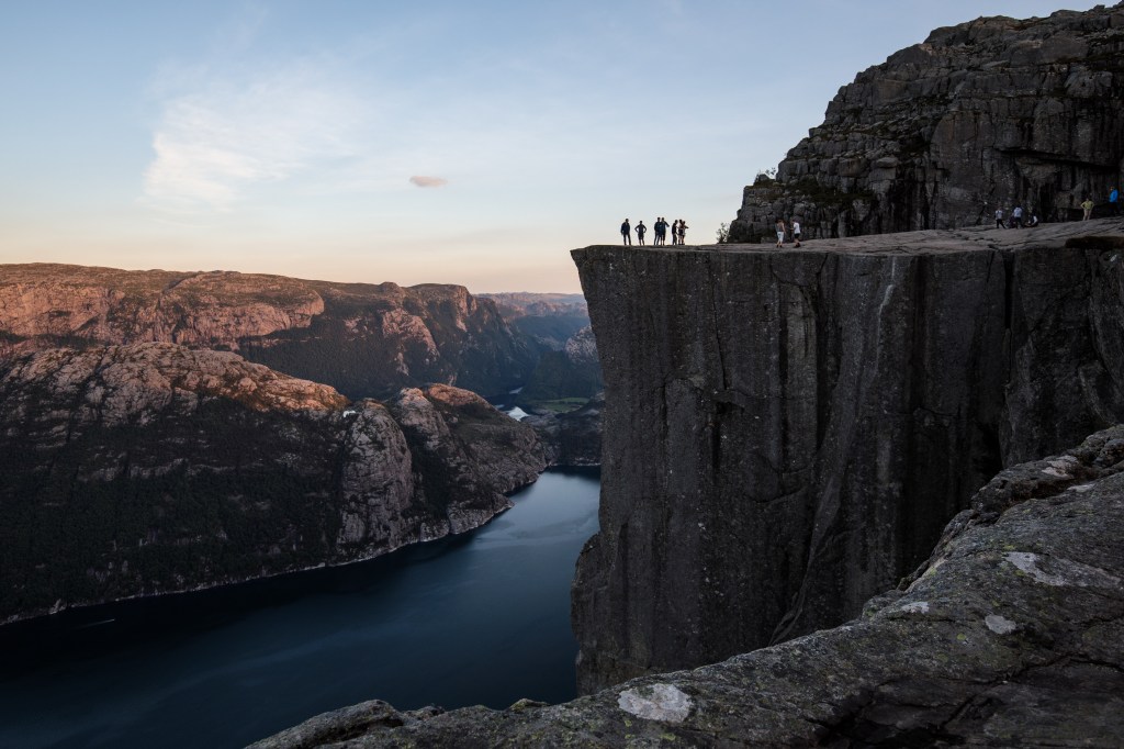 FORSAND, NORWAY - AUGUST 01: Tourists stand on top of Preikestolen ahead of The 'Mission: Impossible - Fallout' Pulpit Rock Norway Screening on August 01, 2018 in Forsand, Norway. (Photo by Jack Taylor/Getty Images for Paramount Pictures)