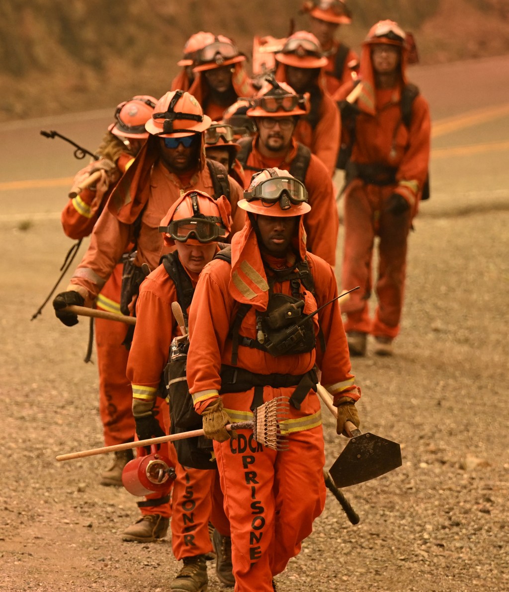 Inmate firefighters work the scene during the Thompson fire in Oroville, California, on July 2, 2024. A heatwave is sending temperatures soaring resulting in red flag fire warnings throughout the state. (Photo by JOSH EDELSON / AFP)