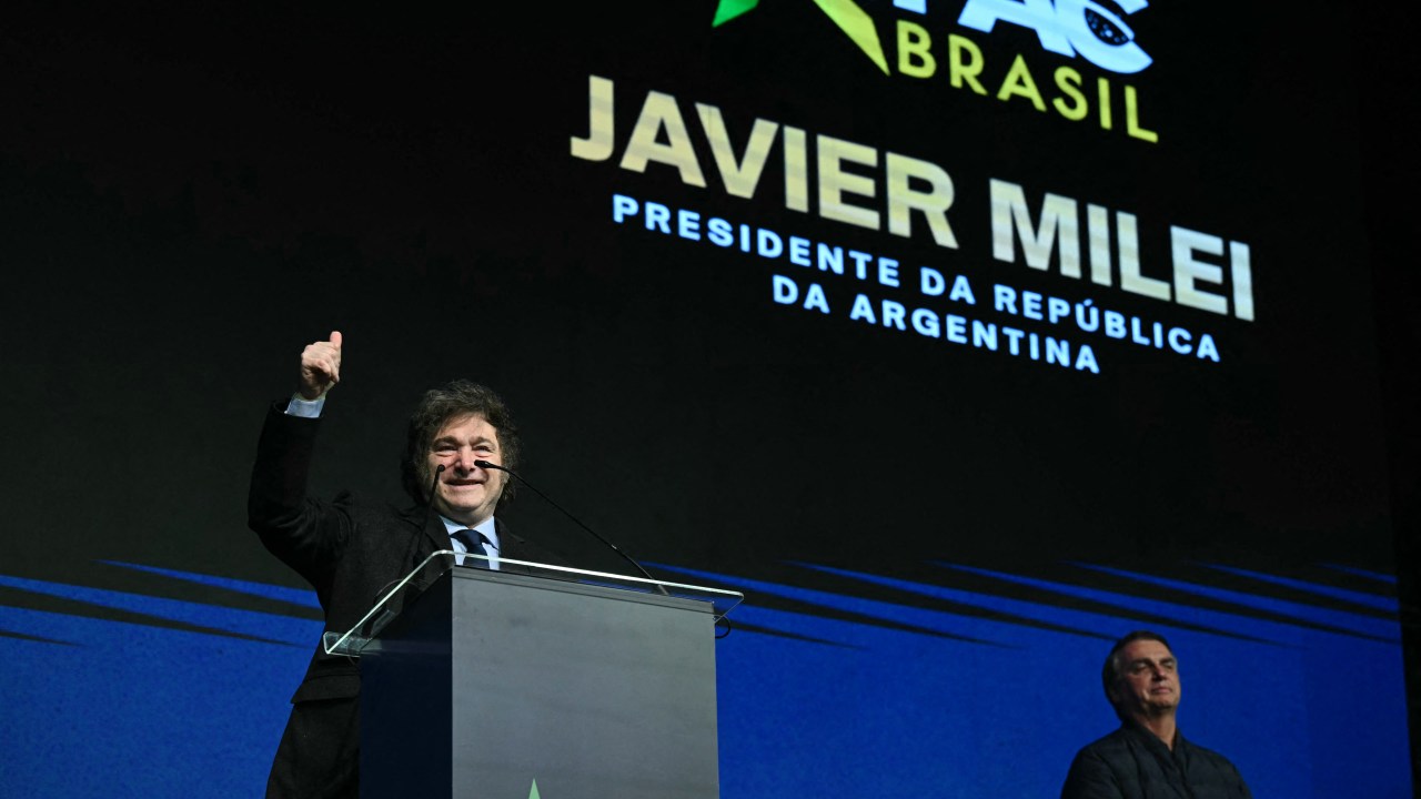 Argentina's President Javier Milei gestures during the CPAC Brazil conference in Camboriu, Santa Catarina State, Brazil on July 7, 2024. Conservative Political Action Conference (CPAC) is a political conference attended by conservative activists and elected officials. (Photo by EVARISTO SA / AFP)