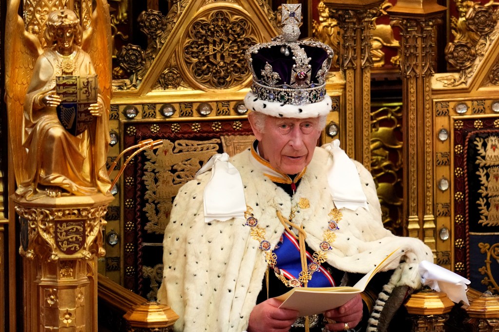 Britain's King Charles III, wearing the Imperial State Crown and the Robe of State, reads the King's Speech from the The Sovereign's Throne in the House of Lords chamber, during the State Opening of Parliament, at the Houses of Parliament, in London, on July 17, 2024. (Photo by Kirsty Wigglesworth / POOL / AFP)