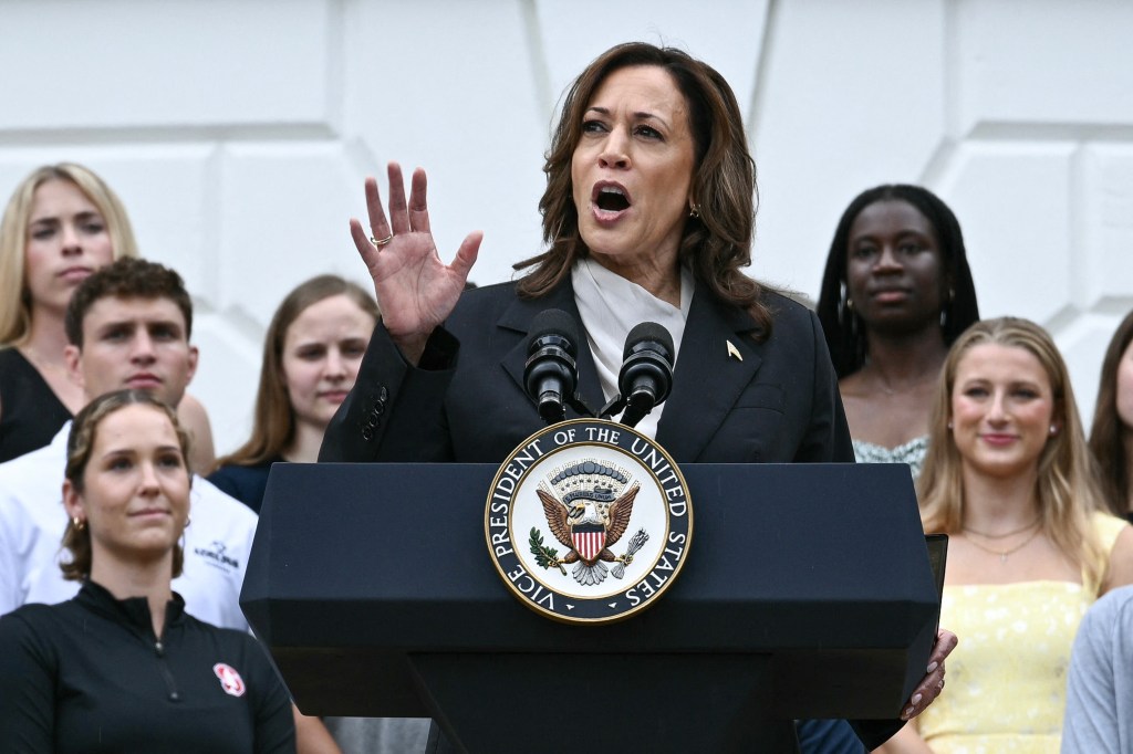 US Vice President Kamala Harris speaks during an event honoring National Collegiate Athletic Association (NCAA) championship teams from the 2023-2024 season, on the South Lawn of the White House in Washington, DC on July 22, 2024. Joe Biden on July 21, 2024 dropped out of the US presidential election and endorsed Vice President Kamala Harris as the Democratic Party's new nominee, in a stunning move that upends an already extraordinary 2024 race for the White House. Biden, 81, said he was acting in the "best interest of my party and the country" by bowing to weeks of pressure after a disastrous June debate against Donald Trump stoked worries about his age and mental fitness. (Photo by Brendan SMIALOWSKI / AFP)