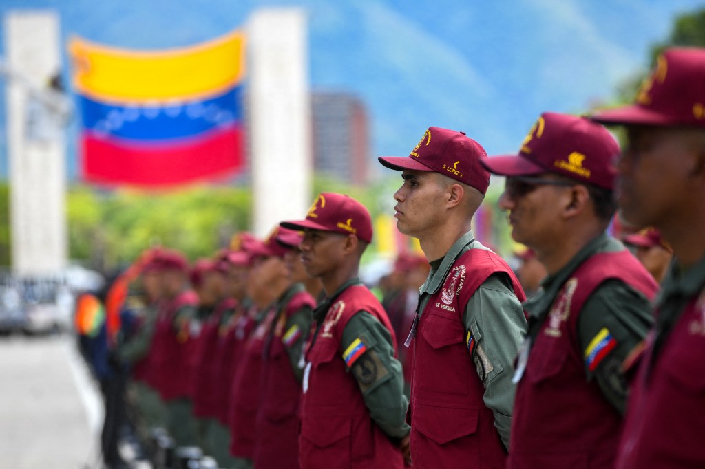 Members of the National Guard participate in a military parade displaying electoral material to be used in the upcoming presidential elections at Fuerte Tiuna in Caracas on July 24, 2024. Venezuela will hold presidential elections on July 28, 2024. (Photo by STRINGER / AFP)