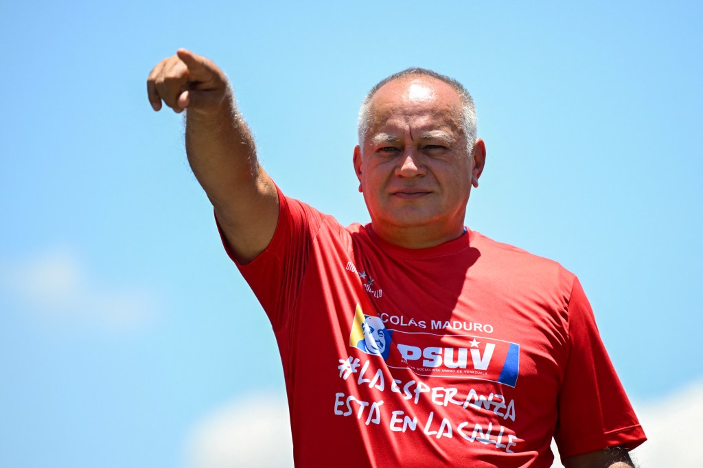 Deputy Diosdado Cabello greets supporters of Venezuelan President and presidential candidate Nicolas Maduro during Maduro's campaign closing rally in Maracaibo, Zulia State, Venezuela, on July 25, 2024, ahead of Sunday's presidential election. Venezuelan President Nicolas Maduro and his main rival in the July 28 presidential elections, opposition candidate Edmundo Gonzalez Urrutia, close their campaigns on Thursday amidst Maduro's warnings of a "bloodbath" or a military insurrection if he is defeated. (Photo by RAUL ARBOLEDA / AFP)