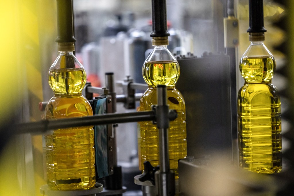 Bottles of olive oil in a capping machine on the production line at the Deoleo SA plant Cordoba, Spain, on Friday, Nov. 11, 2022. Olive oil is Spains third biggest agro-food export with a median output of 1.3 million metric tonnes per year. Photographer: Angel Garcia/Bloomberg via Getty Images