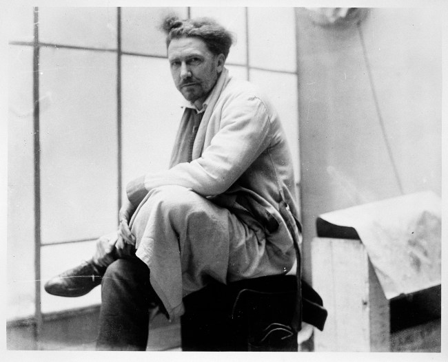Portrait of American expatriate, poet, and critic Ezra Pound (1885 - 1972) as he sits cross-legged, early to mid-twentieth century. (Photo by United States Information Agency/PhotoQuest/Getty Images)