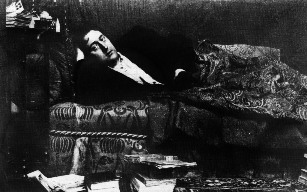 Guillaume Apollinaire, French poet, writer, art critic and dramatist, lying on the divan at home. Paris, 1909 (Photo by Mondadori via Getty Images)