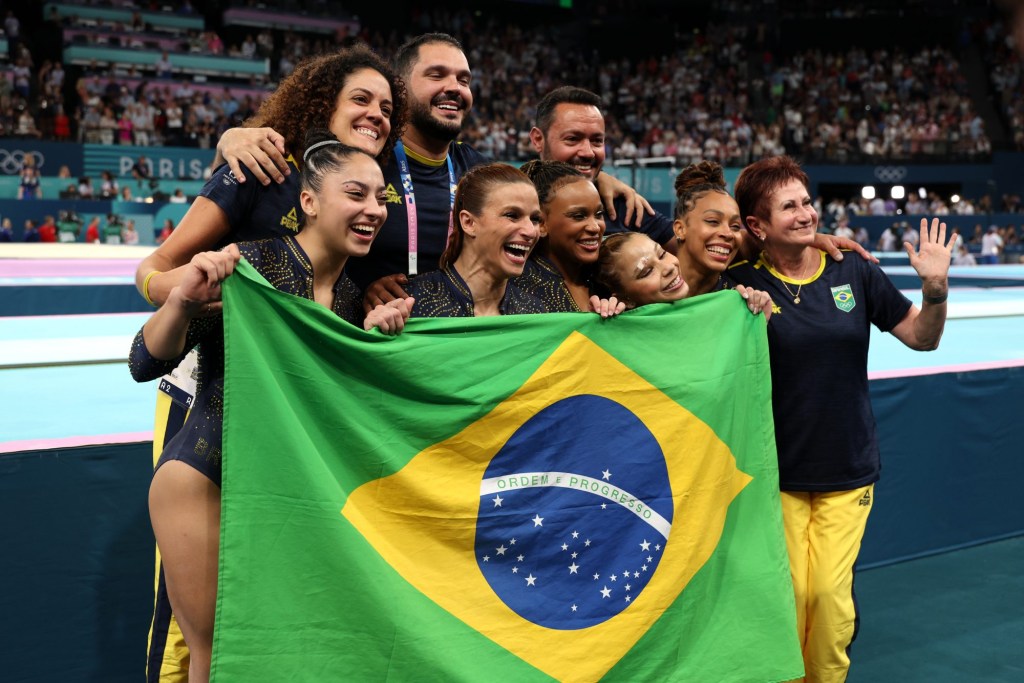 PARIS, FRANCE - JULY 30: Members of Team Brazil celebrate winning the bronze medal during the Artistic Gymnastics Women's Team Final on day four of the Olympic Games Paris 2024 at Bercy Arena on July 30, 2024 in Paris, France. (Photo by Jamie Squire/Getty Images)