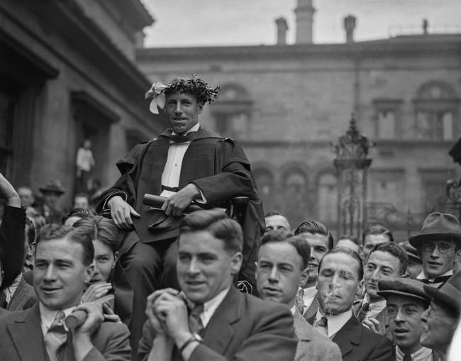 18th July 1924: Eric Liddell (1902 - 1945), winner of the 400 metres at the 1924 Paris Olympics, is paraded around Edinburgh University after his victory. He was known as the 'Flying Scotsman' and was immortalised in the film Chariots of Fire. (Photo by Firmin/Topical Press Agency/Hulton Archive/Getty Images)