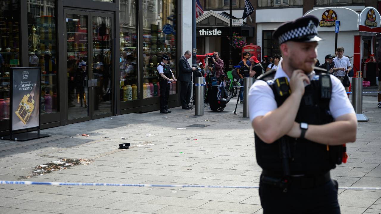 LONDON, ENGLAND - AUGUST 12: A police officer stands near a cordoned area following a doublestabbing at Leicester Square on August 12, 2024 in London, England. An 11-year-old girl and a 34-year-old woman were taken to hospital earlier following a stabbing just before midday, according to the Met Police, who added that a man was arrested after the incident. The woman received minor injuries and the girl would require continued hospitalisation, although her injuries were not life threatening. (Photo by Leon Neal/Getty Images)