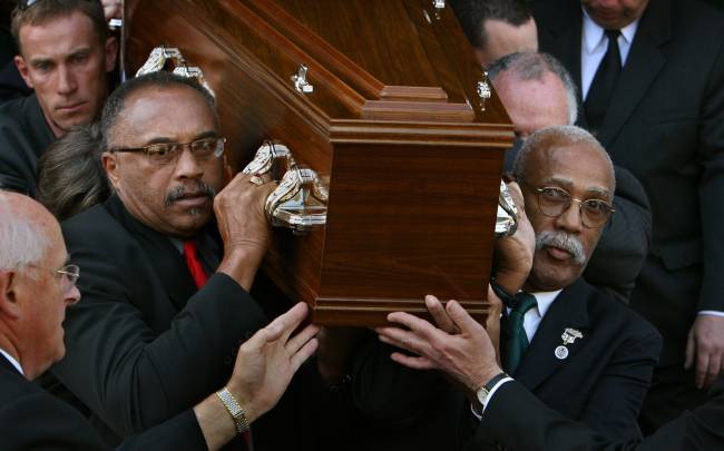 (AUSTRALIA OUT) Athletes Tommie Smith, (left) and John Carlos carry Peter Norman's casket from the Williamstown Town Hall on 9th October, 2006. THE AGE NEWS Picture by ANGELA WYLIE. (Photo by Fairfax Media via Getty Images/Fairfax Media via Getty Images via Getty Images)