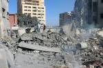 People inspect the destruction at the site of an Israeli airstrike in the southern Lebanese city of Tyre on October 29, 2024. Israel launched fresh strikes on October 28 on Tyre, Lebanese state media said, after the Israeli military told swathes of the southern city to evacuate and following an earlier raid that killed seven people. (Photo by Bilal KASHMAR / AFP)