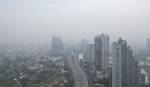 Aerial view of highway street road at Bangkok Downtown Skyline, Thailand. Financial district and business centers in urban city in Asia. Skyscraper buildings with fog. Air pollution pm2.5